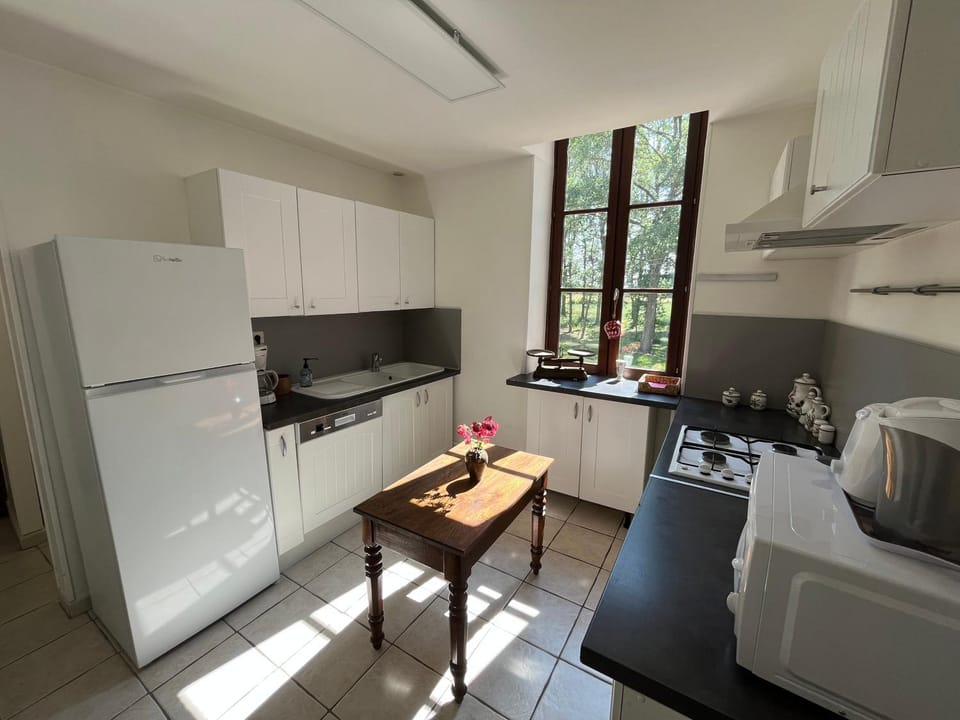 Kitchen or kitchenette, dishwasher, oven, stove