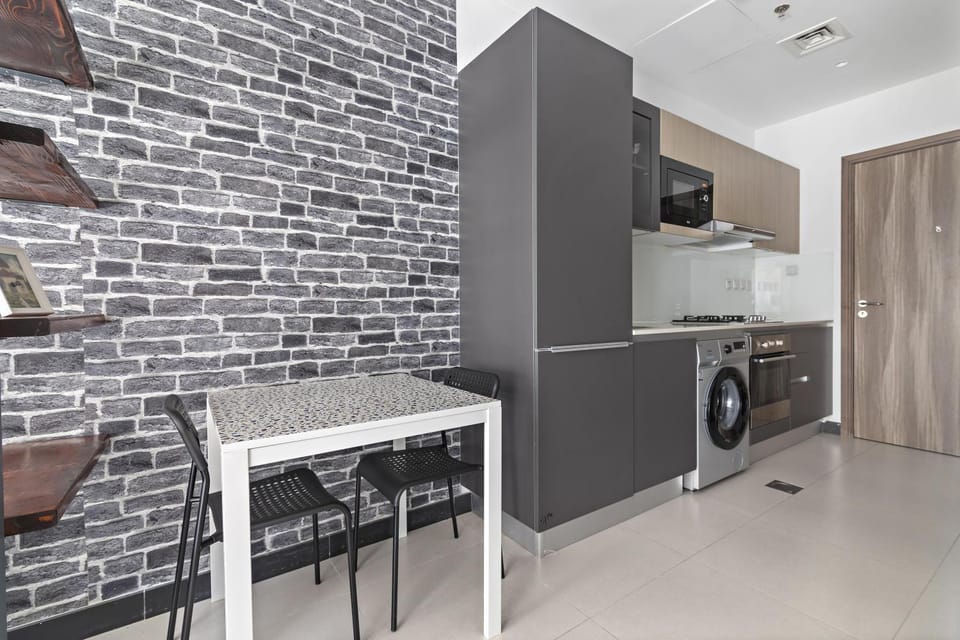Kitchen or kitchenette, oven, stove, washing machine, dryer