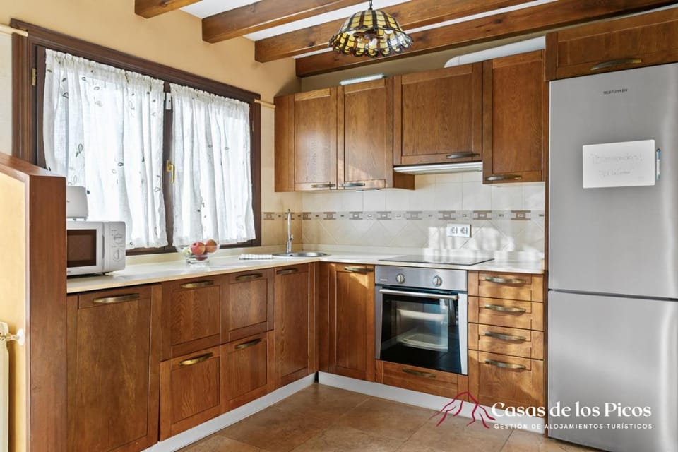 Kitchen or kitchenette, dishwasher, oven, stove