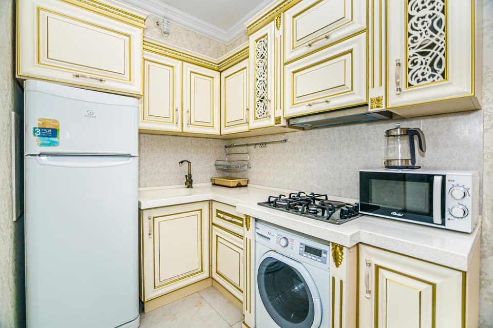 Kitchen or kitchenette, dishwasher, oven, stove, toaster, washing machine, dryer