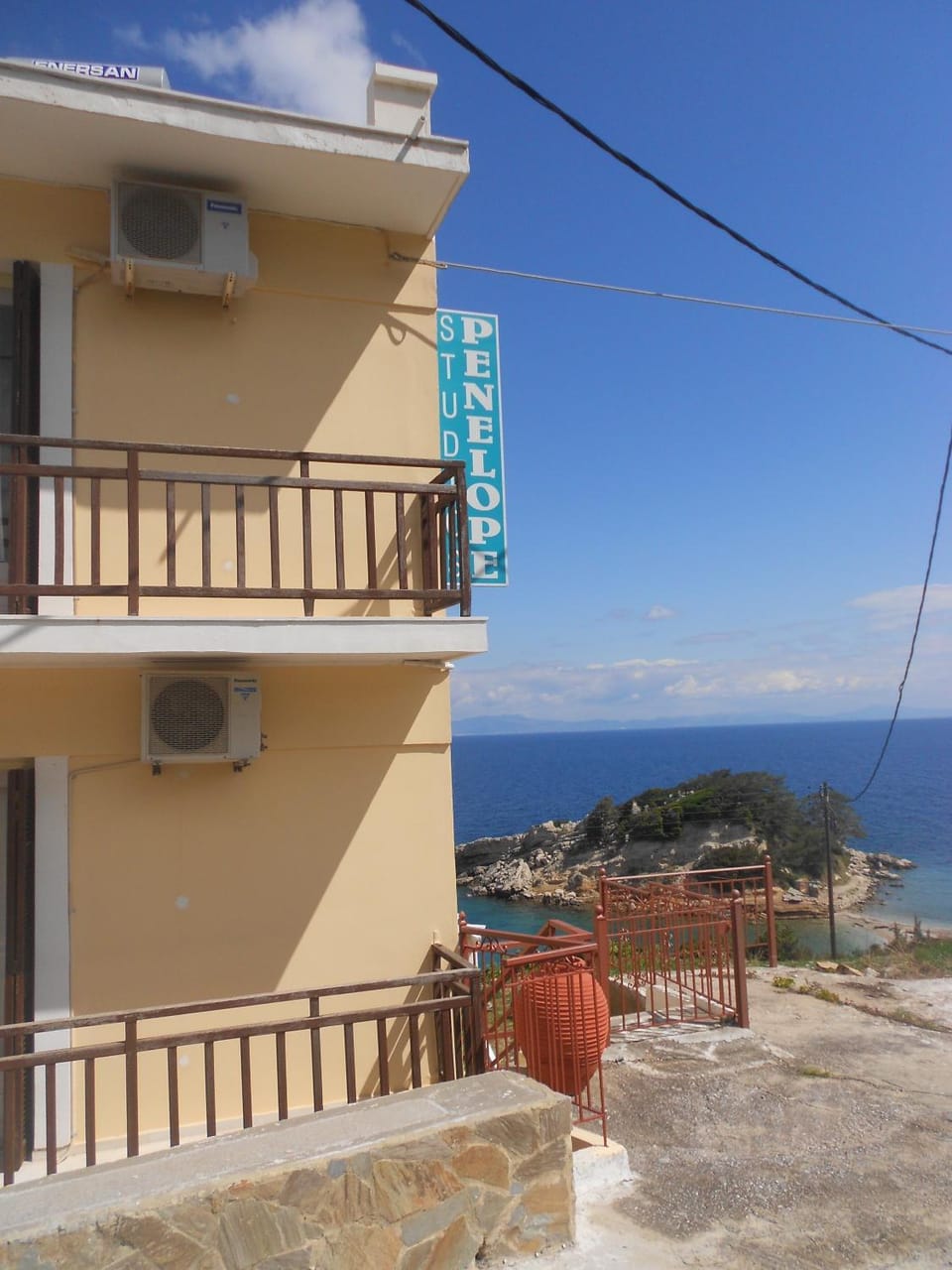 Property building, Facade/entrance, Property logo or sign, Natural landscape, Balcony/Terrace, Mountain view, Sea view