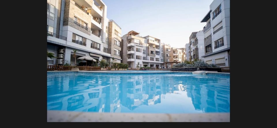 Property building, Day, Pool view, Swimming pool, sunbed