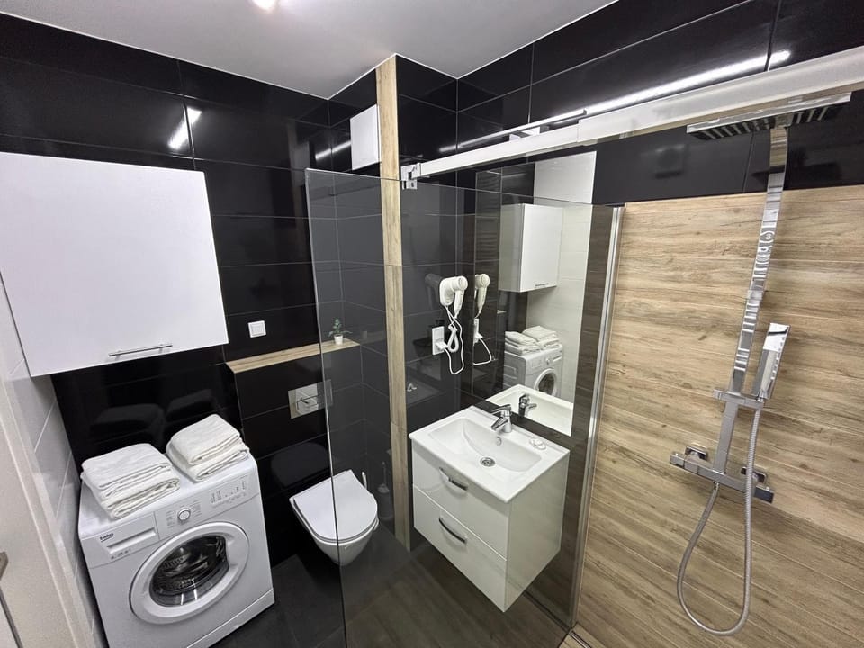 Shower, Toilet, Bathroom, towels, washing machine, dryer