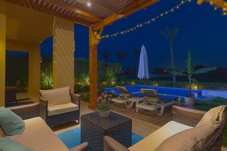 Patio, Night, Natural landscape, Garden, Living room, Seating area, Garden view, Pool view, Swimming pool, sunbed