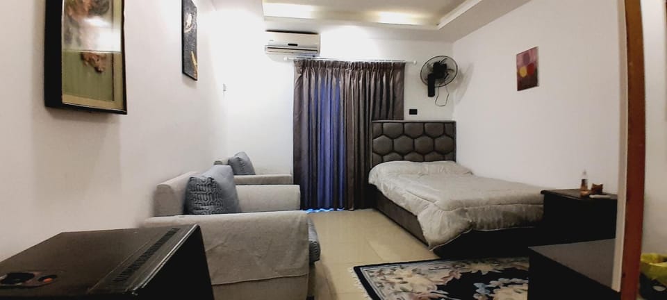 Bed, Living room, Seating area, Bedroom, air conditioner