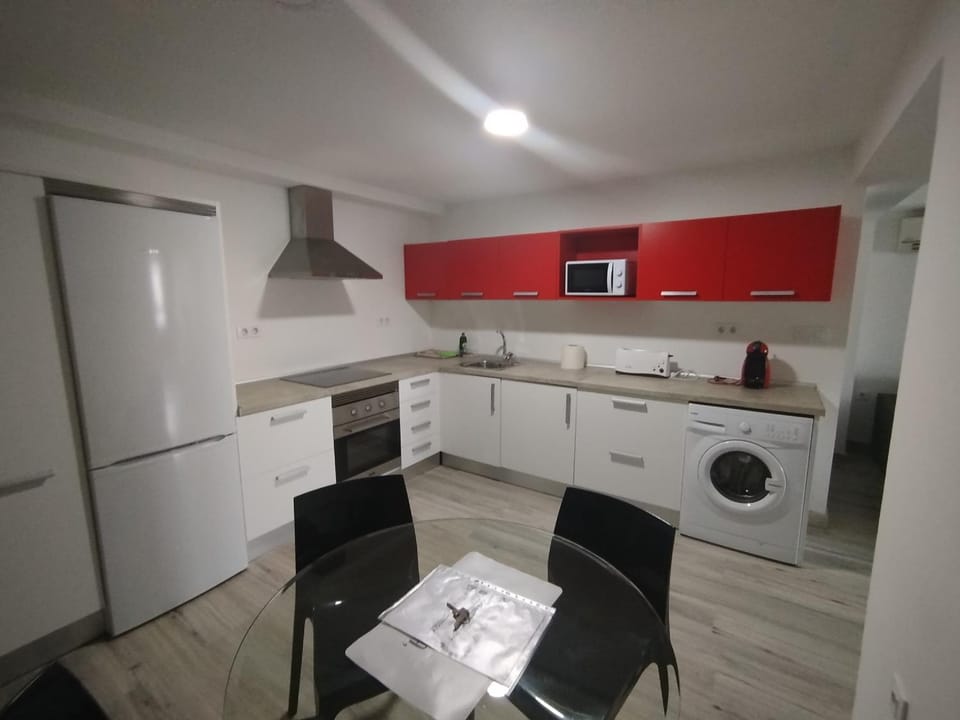 Kitchen or kitchenette, washing machine