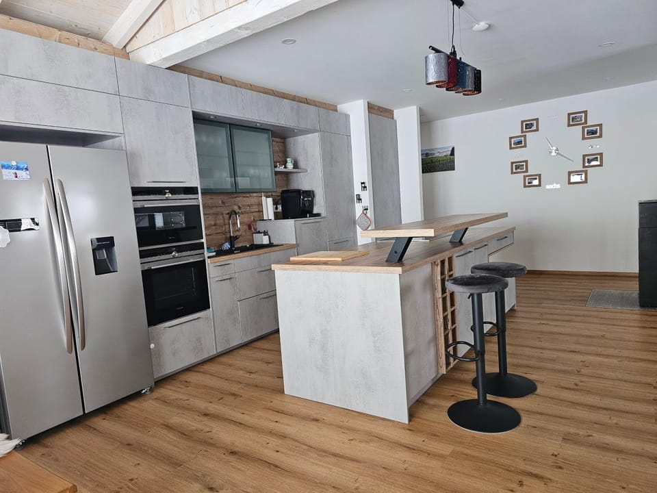 Kitchen or kitchenette, dishwasher, oven, stove