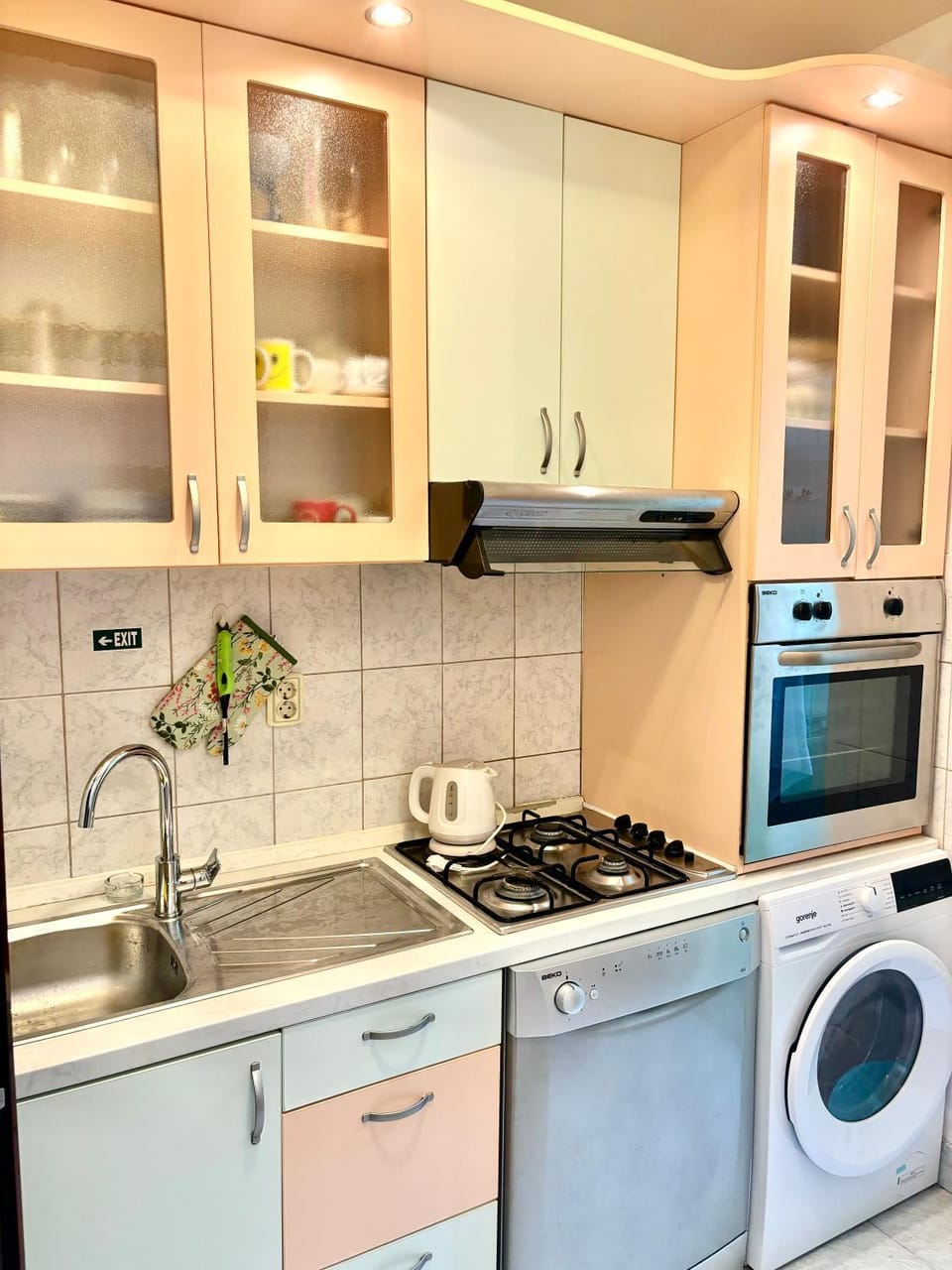 Kitchen or kitchenette, dishwasher, oven, washing machine, dryer