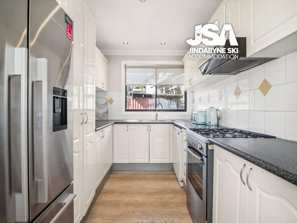 Kitchen or kitchenette, dishwasher, oven, stove