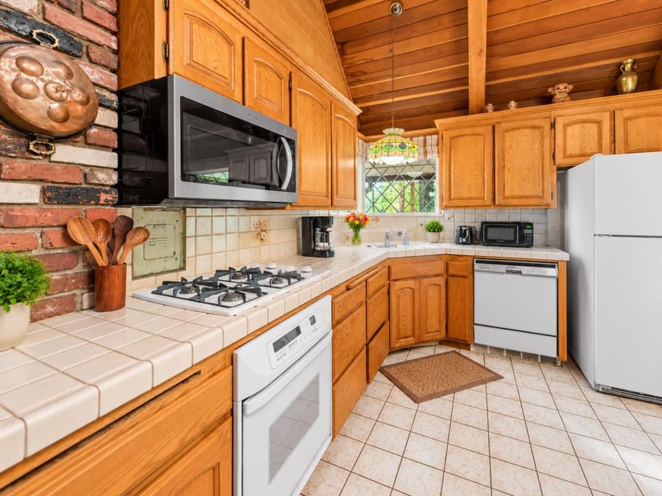 Kitchen or kitchenette, dishwasher, oven, stove, toaster