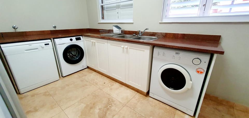 Kitchen or kitchenette, dishwasher, washing machine, dryer