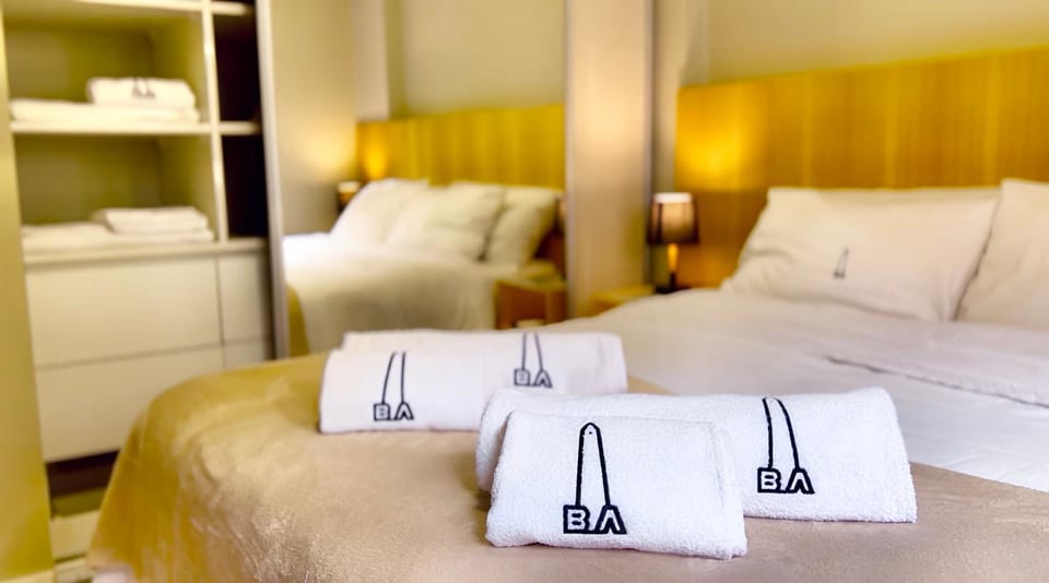 Bed, towels, wardrobe