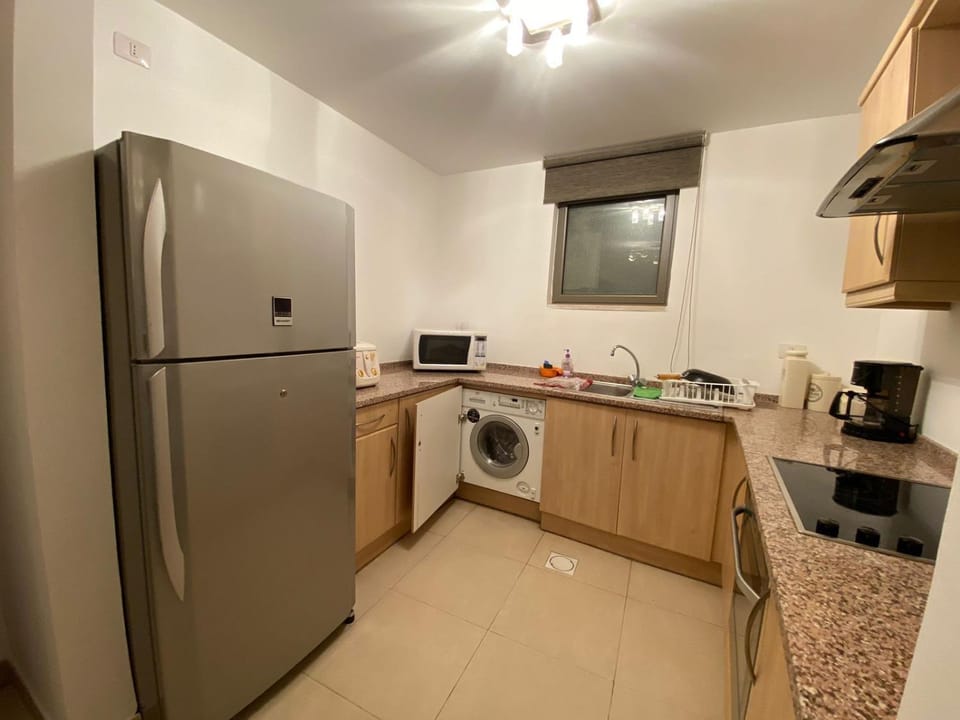 Lovely first floor tow bed rooms overviewing circular pool for families only in Talabay Aqaba Apartment in South District