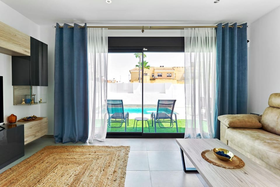 Living room, Seating area, Pool view