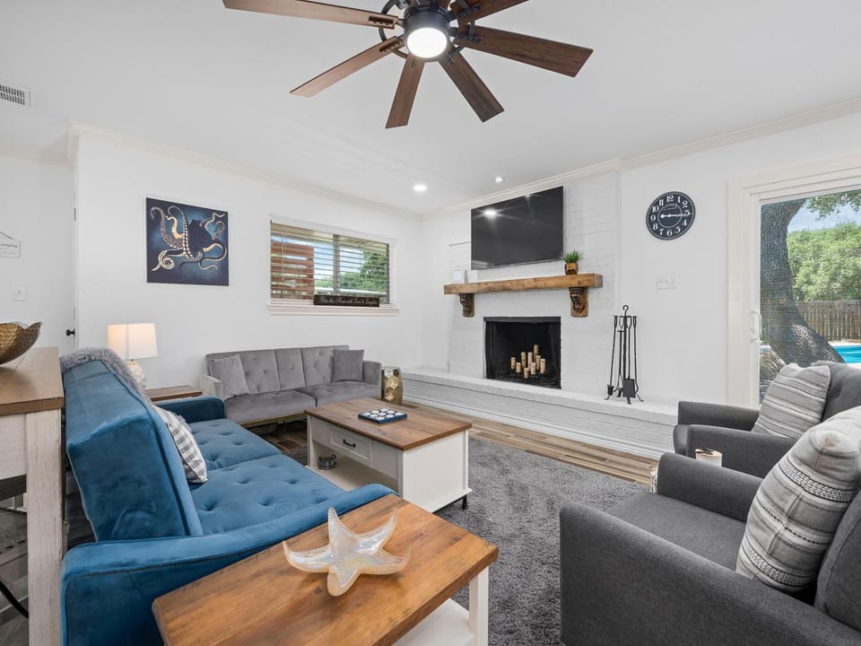 TV and multimedia, Living room, Seating area, Pool view, fireplace, furniture