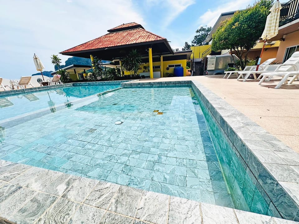 Property building, Pool view, Swimming pool, sunbed
