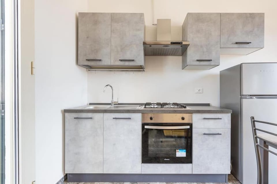 Kitchen or kitchenette, dishwasher, oven, stove