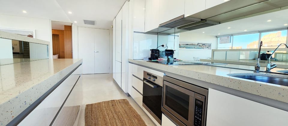 Kitchen or kitchenette, dishwasher, oven, stove, toaster