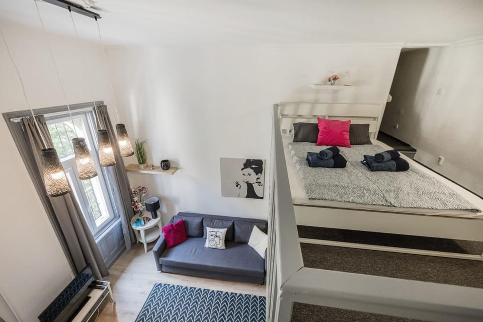 Bed, Living room, Seating area, Bedroom