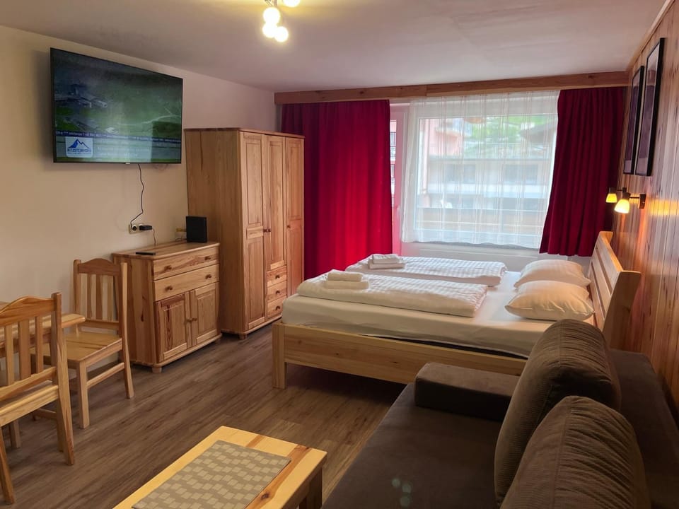 Communal lounge/ TV room, Bed, TV and multimedia, Living room, Seating area, Bedroom, hair dresser, wardrobe