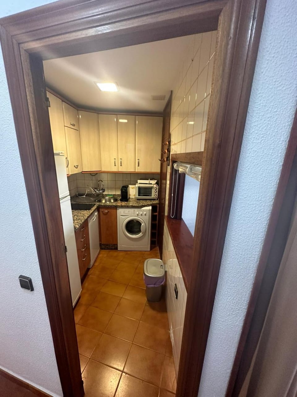 Kitchen or kitchenette, washing machine