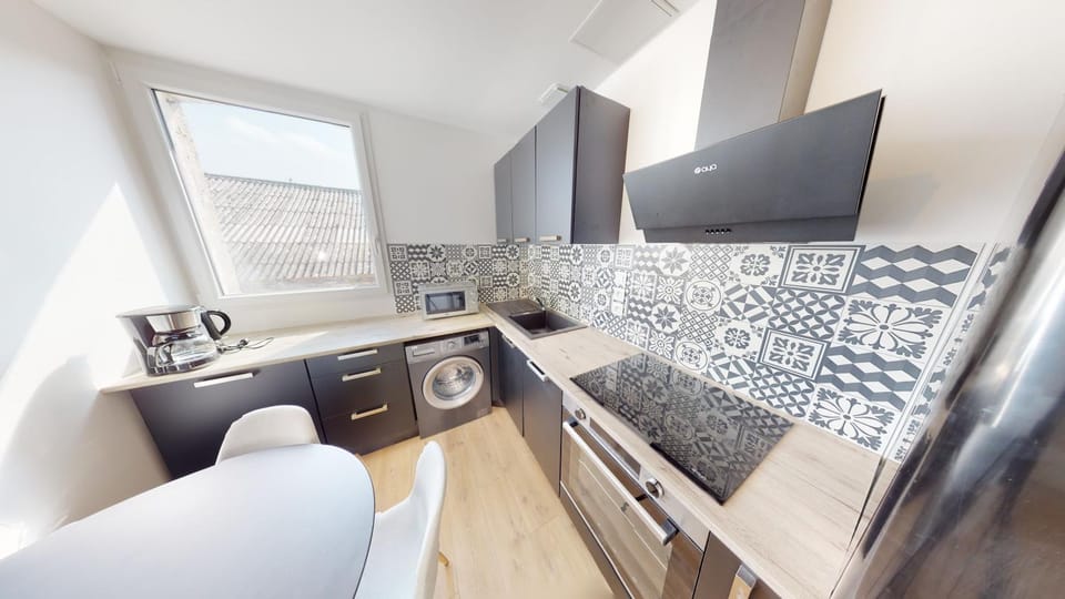 Kitchen or kitchenette, dishwasher, oven, stove, washing machine