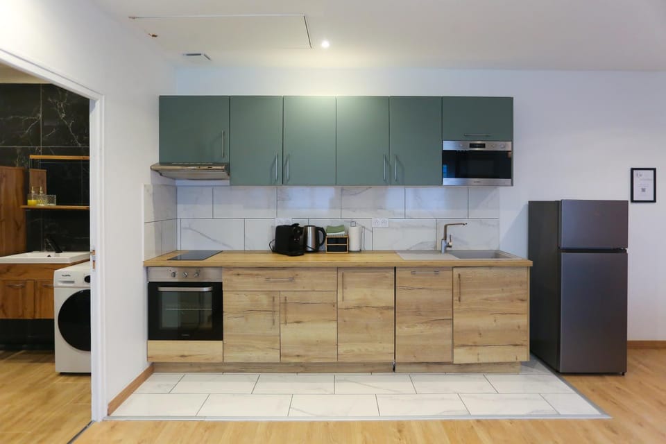 Kitchen or kitchenette, dishwasher, oven, stove, toaster