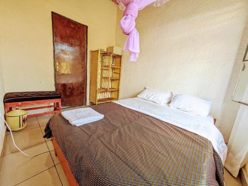 Bed, Photo of the whole room, hair dryier, towels, wardrobe