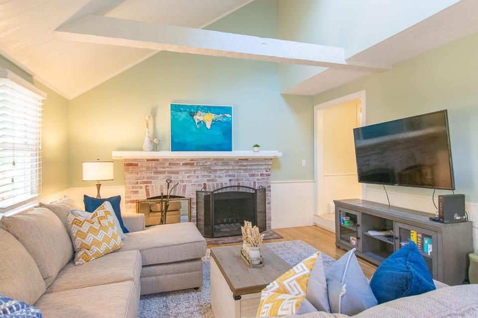 Spacious Stone Fire Pit Game Room House in Osterville