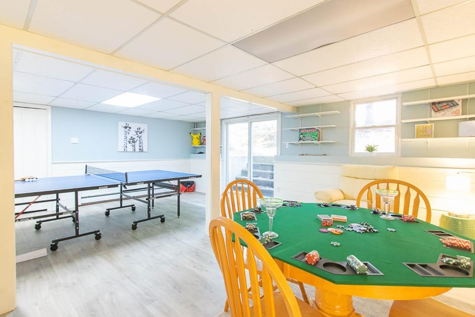 Spacious Stone Fire Pit Game Room House in Osterville