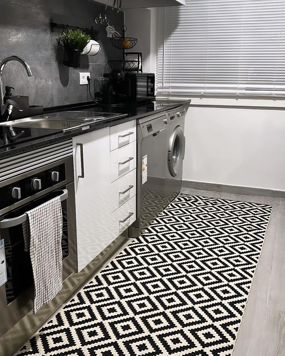 Kitchen or kitchenette, dishwasher, stove, washing machine