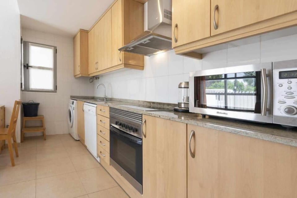 Kitchen or kitchenette, dishwasher, oven, stove