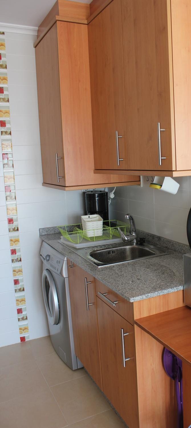 Kitchen or kitchenette, minibar, stove, washing machine