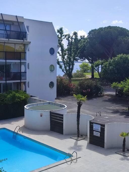 Property building, Patio, Day, Pool view, Swimming pool
