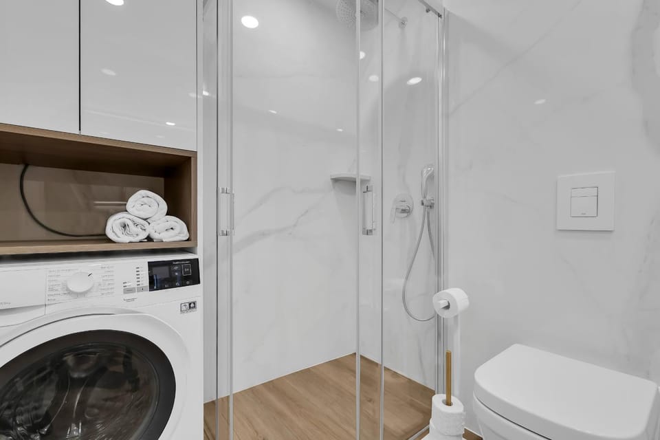Shower, Toilet, Bathroom, towels, washing machine, dryer