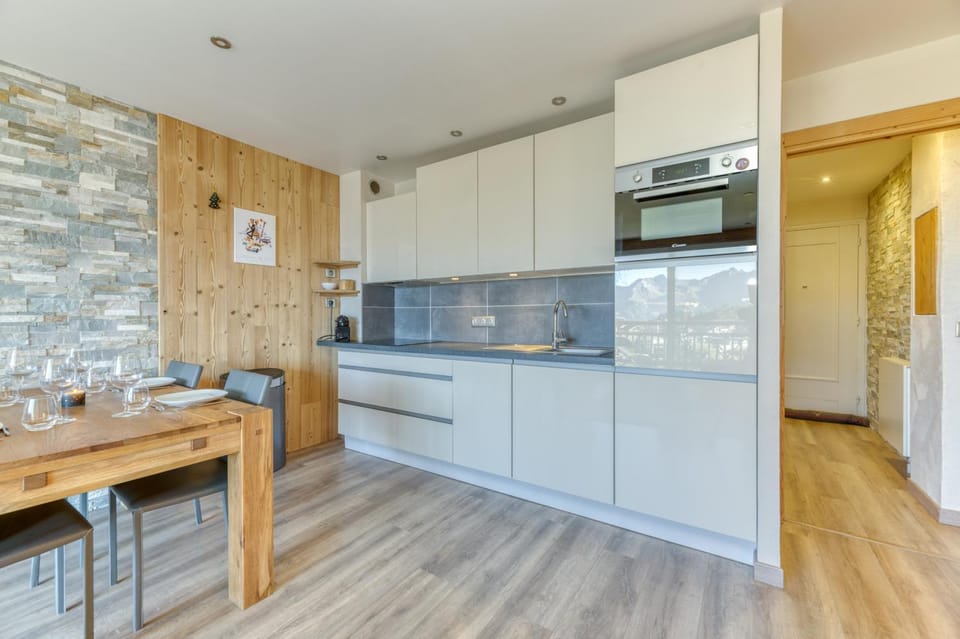 Kitchen or kitchenette, dishwasher, oven, stove