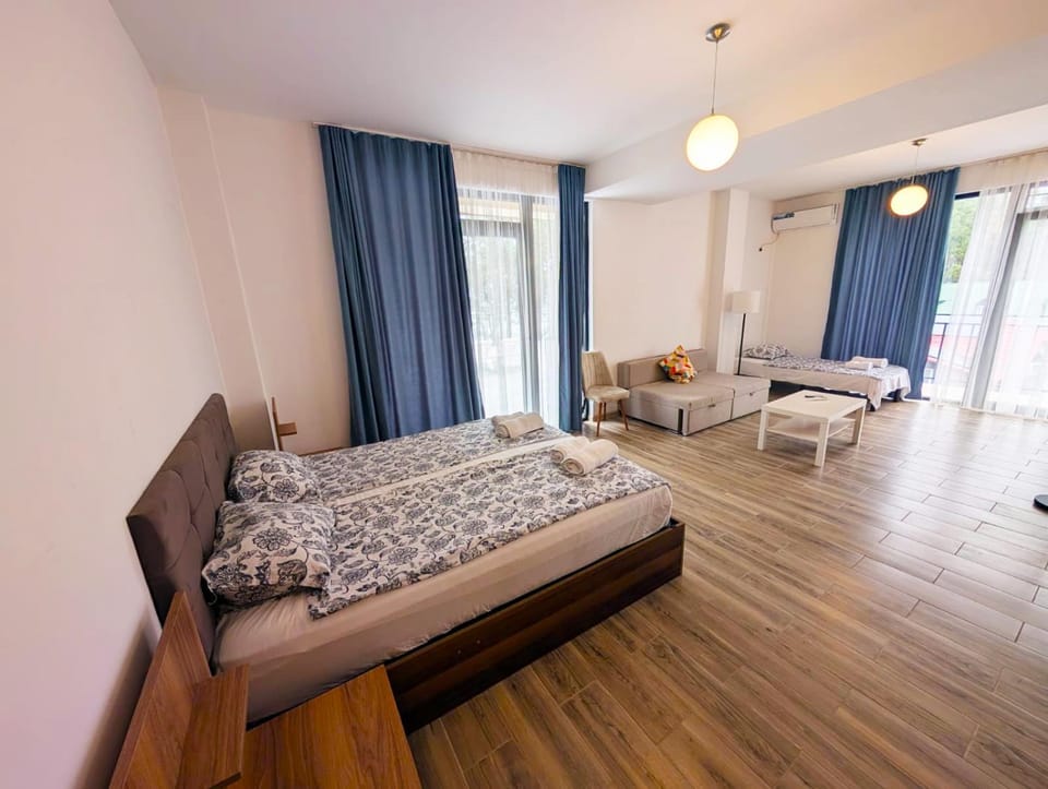 Bed, Living room, Seating area, Bedroom