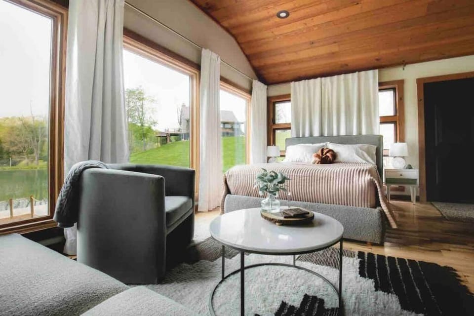 Bed, View (from property/room), Living room, Seating area, Bedroom, Lake view, River view