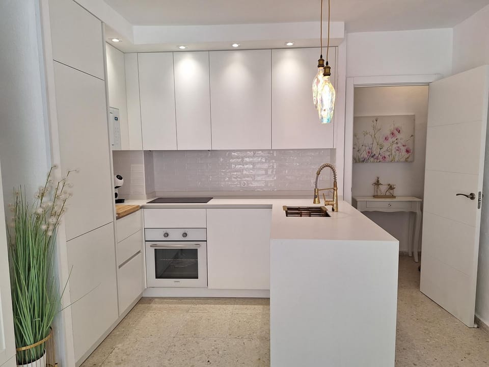 Kitchen or kitchenette, dishwasher, oven, stove