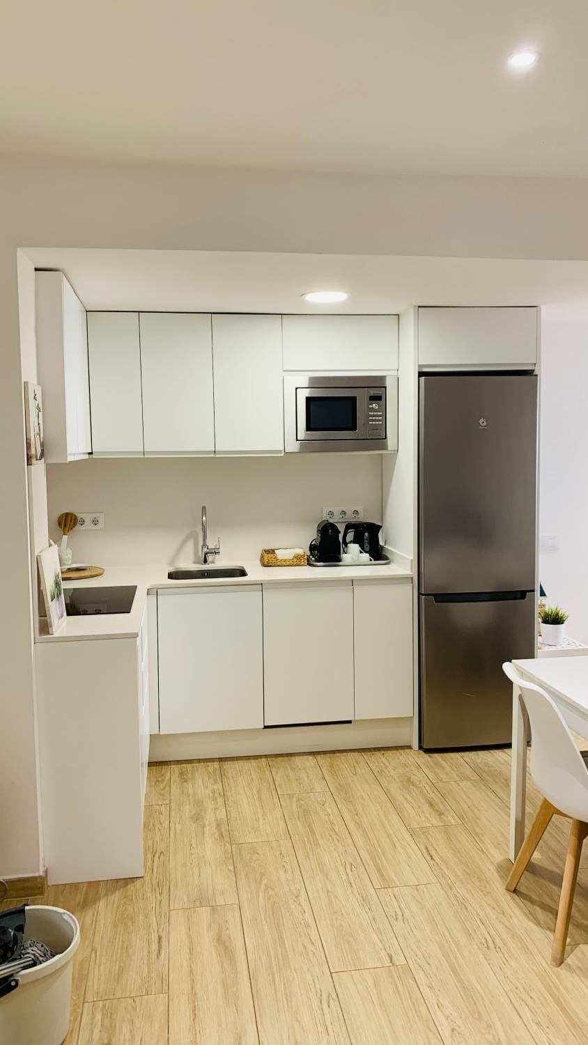Kitchen or kitchenette, dishwasher, oven, stove, toaster