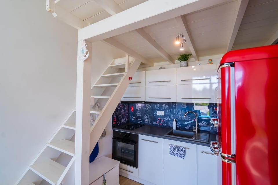 Kitchen or kitchenette, dishwasher, oven, stove