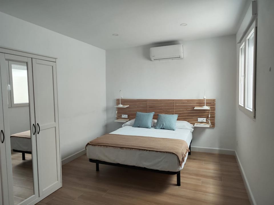 Bed, wardrobe, air conditioner