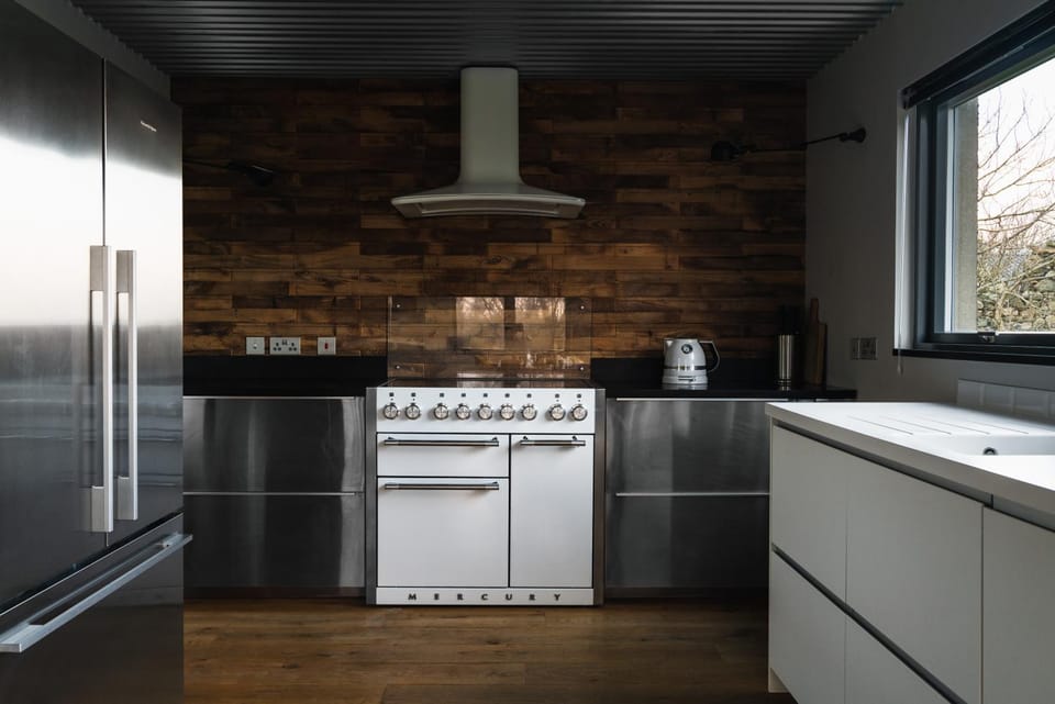 Kitchen or kitchenette, dishwasher, oven, stove