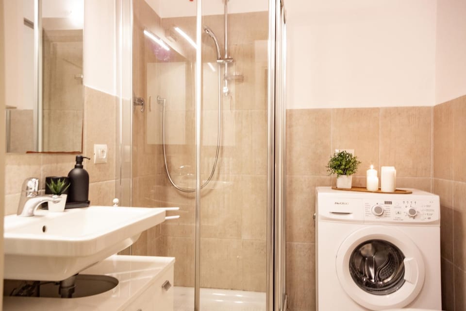 Shower, Toilet, Bathroom, bidet, towels, washing machine