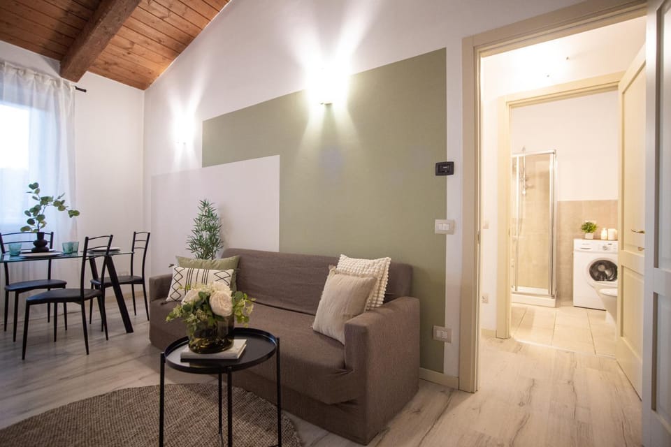Shower, Bed, Bathroom, Seating area, washing machine