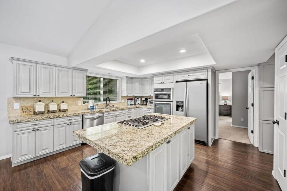 Kitchen or kitchenette, dishwasher, furniture, minibar, oven, stove, air conditioner