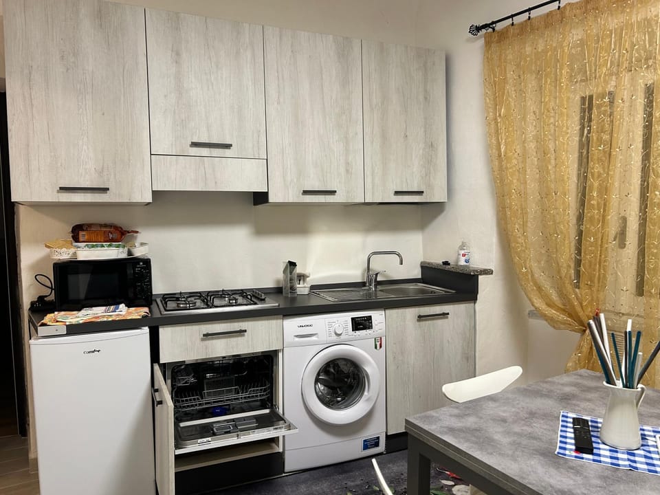 Kitchen or kitchenette, dishwasher, stove, washing machine