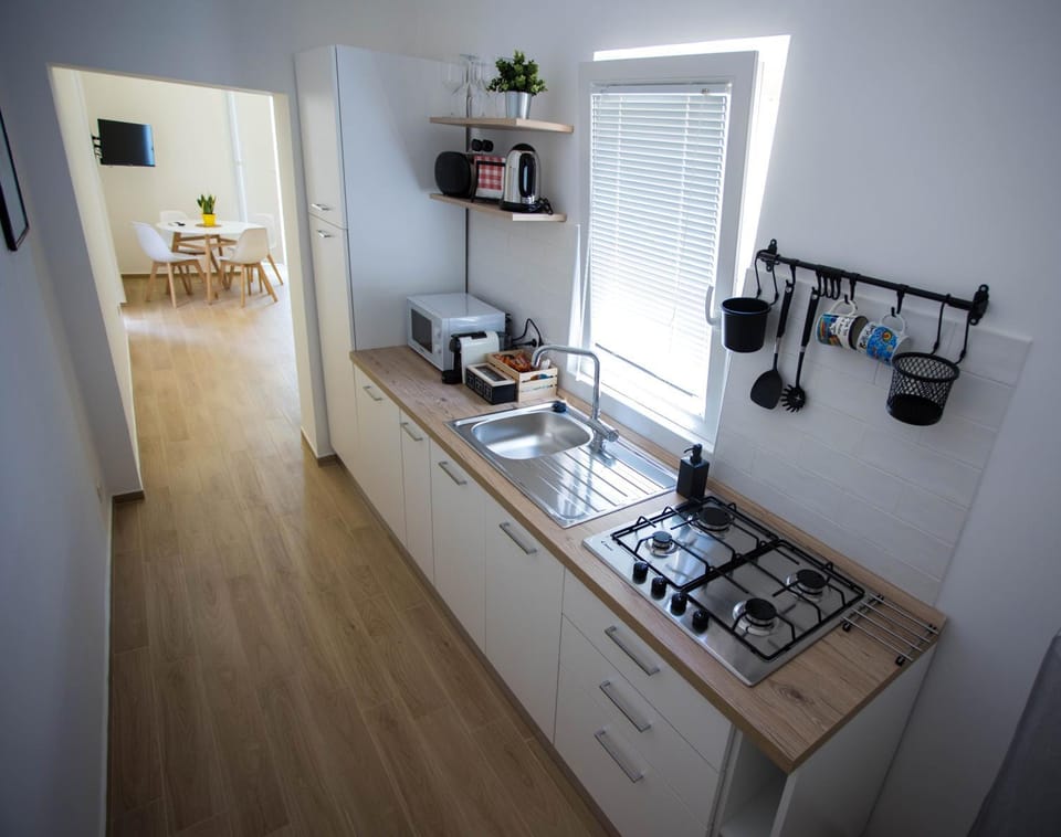 Kitchen or kitchenette, microwave, stove, toaster