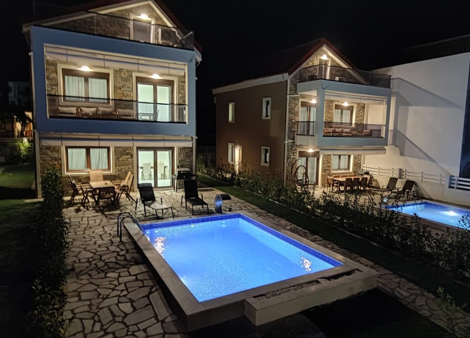 Property building, Patio, Night, Pool view, Swimming pool, sunbed