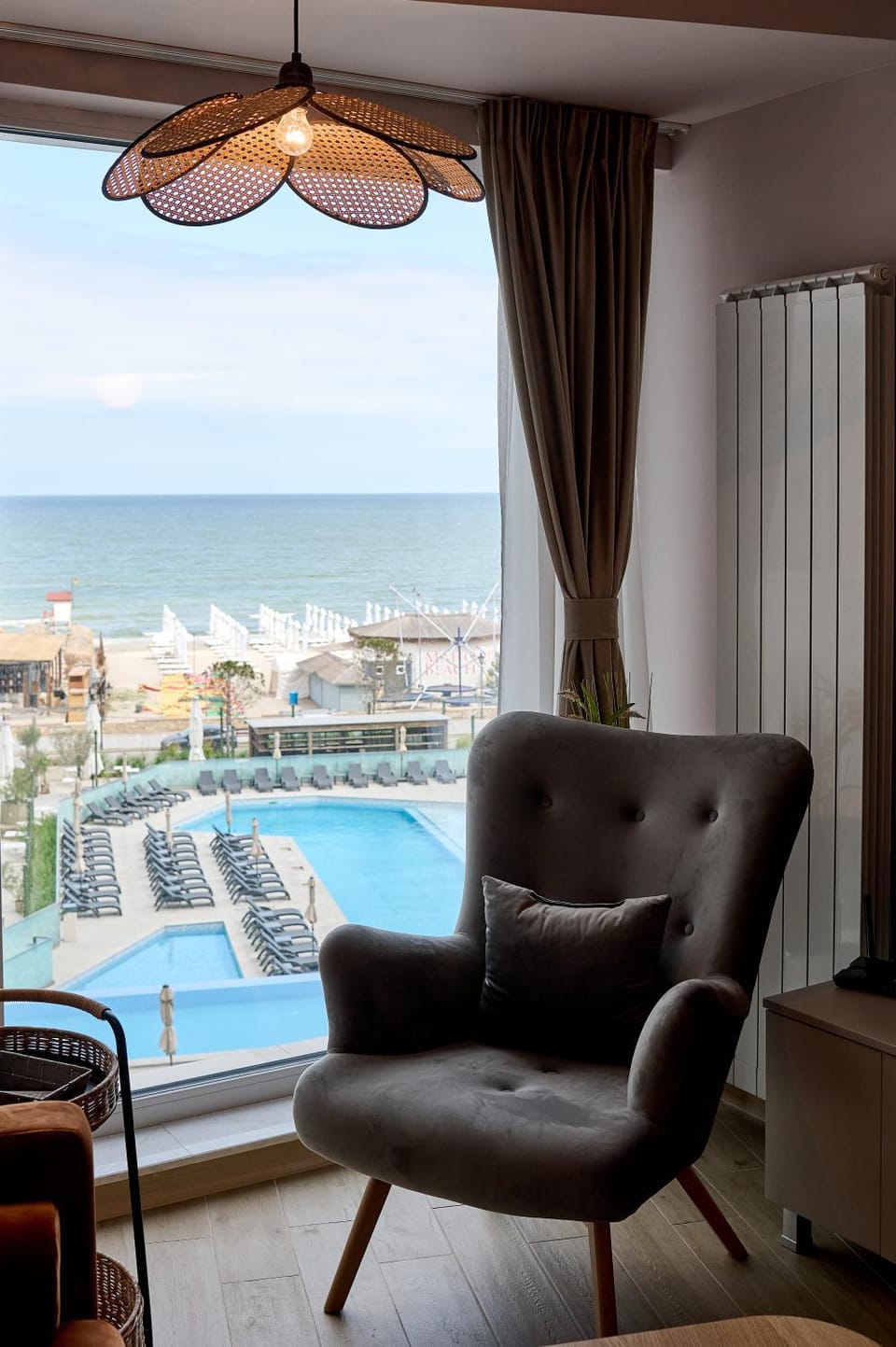 View (from property/room), Living room, Seating area, Sea view, Swimming pool